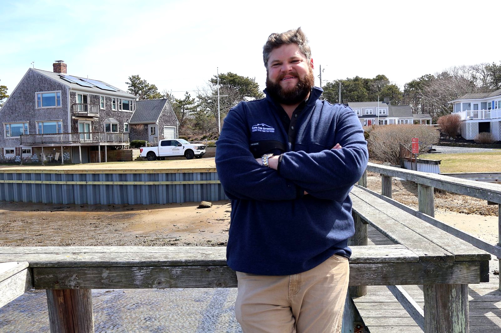 Andrew Bass, Cape Cod Exteriors founder, on waterfront dock